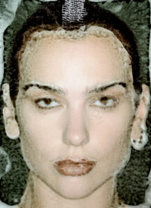 A woman's face emerges through frosted glass, creating a blurred effect. Her expression is serene, with dark eyes and prominent lips. Her hair is pulled back, and she wears earrings. The obscured surface adds a dreamlike quality, softening the facial features and creating an artistic, textured impression. Light and shadow interplay subtly across the scene.