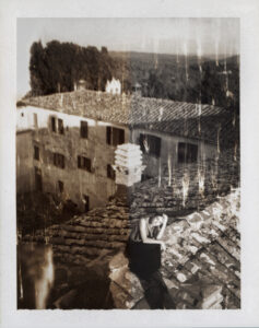 A young woman sits on a rustic tiled rooftop, draped in a long, dark dress. Her pose is thoughtful, hand resting on her head. The background features an old stone building with shuttered windows, surrounded by dense trees. The overall atmosphere exudes a vintage and sepia-toned charm, evoking a sense of nostalgia and serenity.